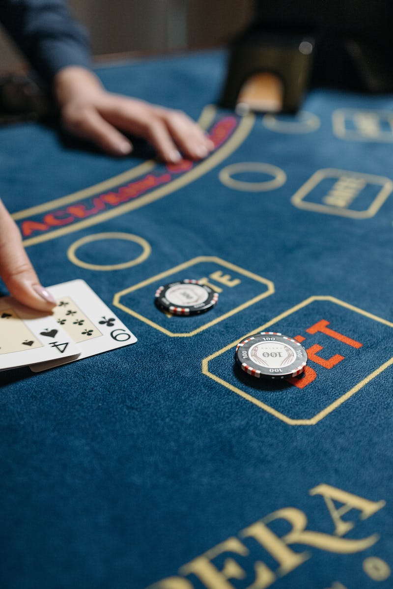 Playing cards and casino chips arranged on a gaming table