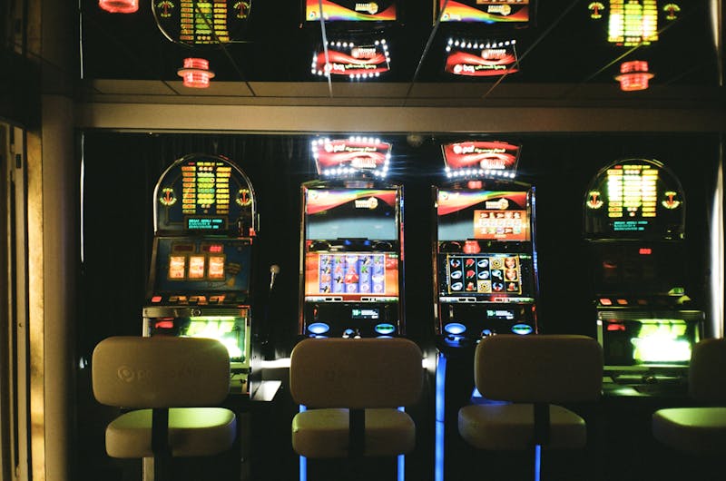 A row of slot machines with no people and no educational framing